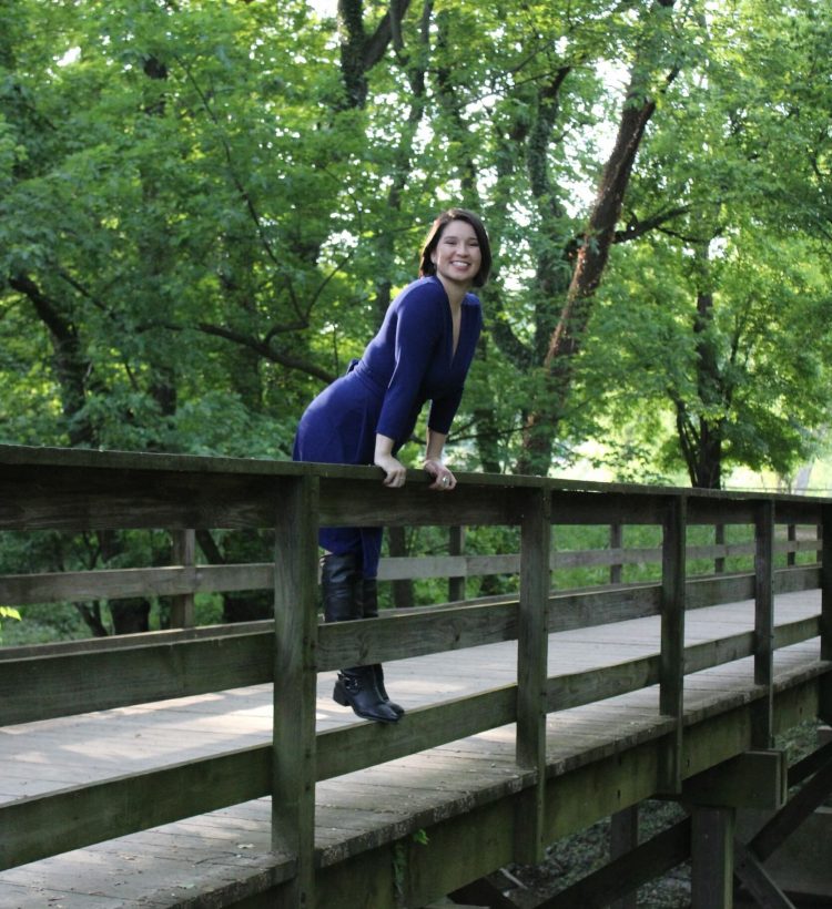 Michelle Standing over the Edge of a Bridge